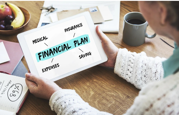 A house move budget planner with calculator and paperwork